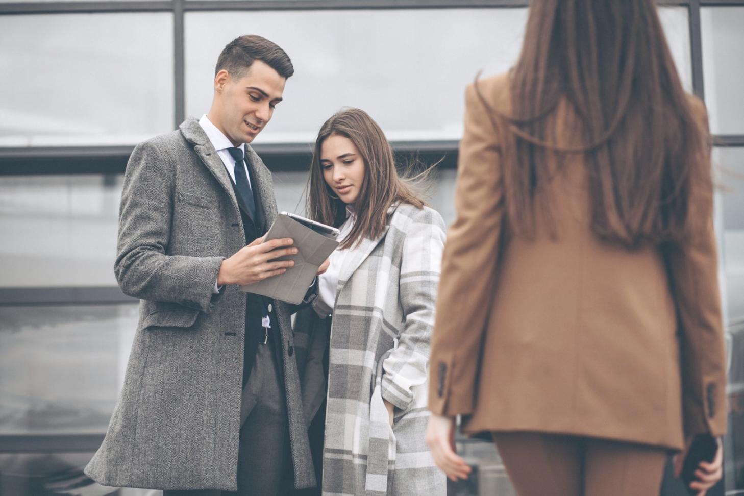 Financial automation workspace showing modern office setup with multiple monitors displaying financial dashboards and automation workflows